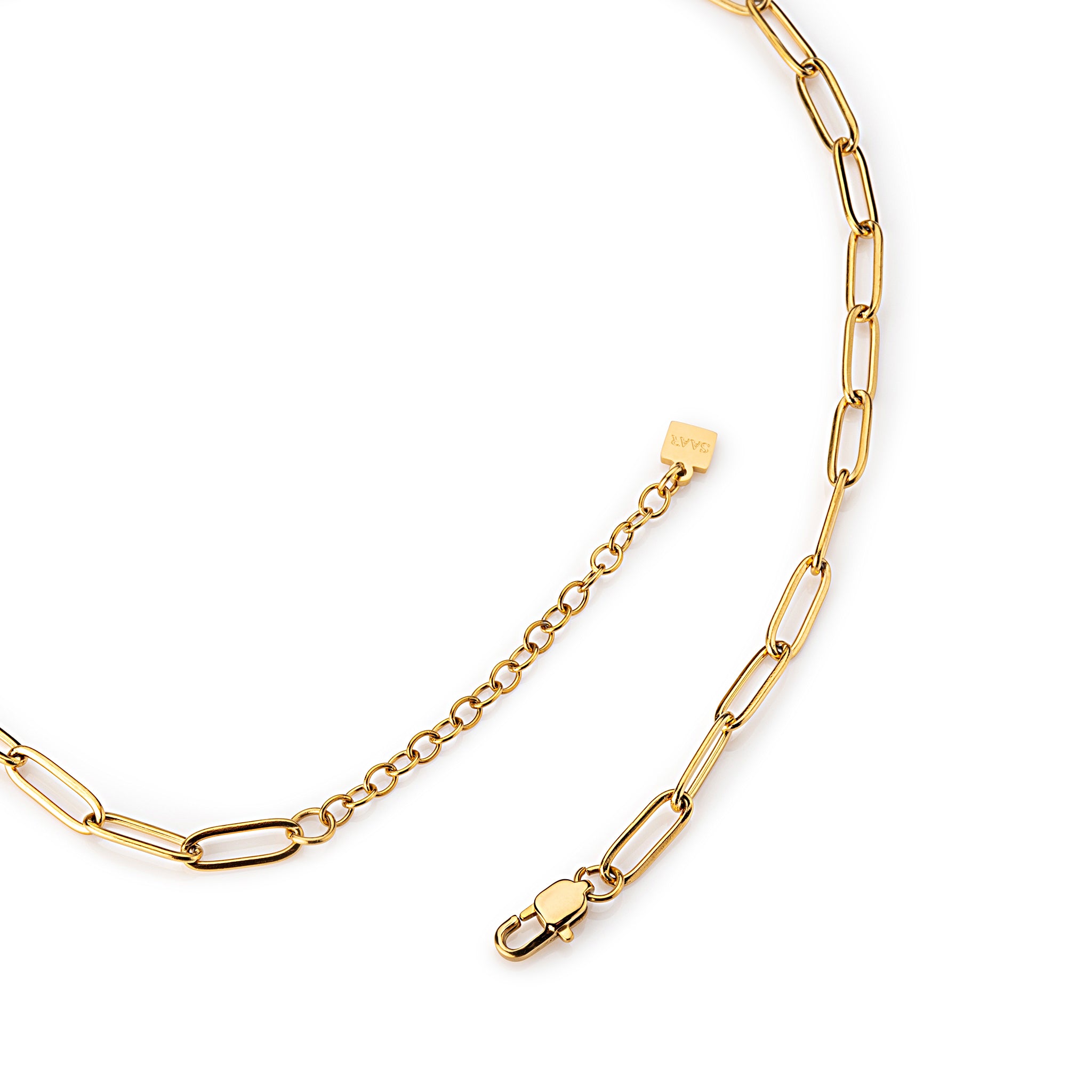 SAAR Co's Abbie, an 18k Gold, 4mm paperclip link chain, and extension chain with SAAR CO tag.