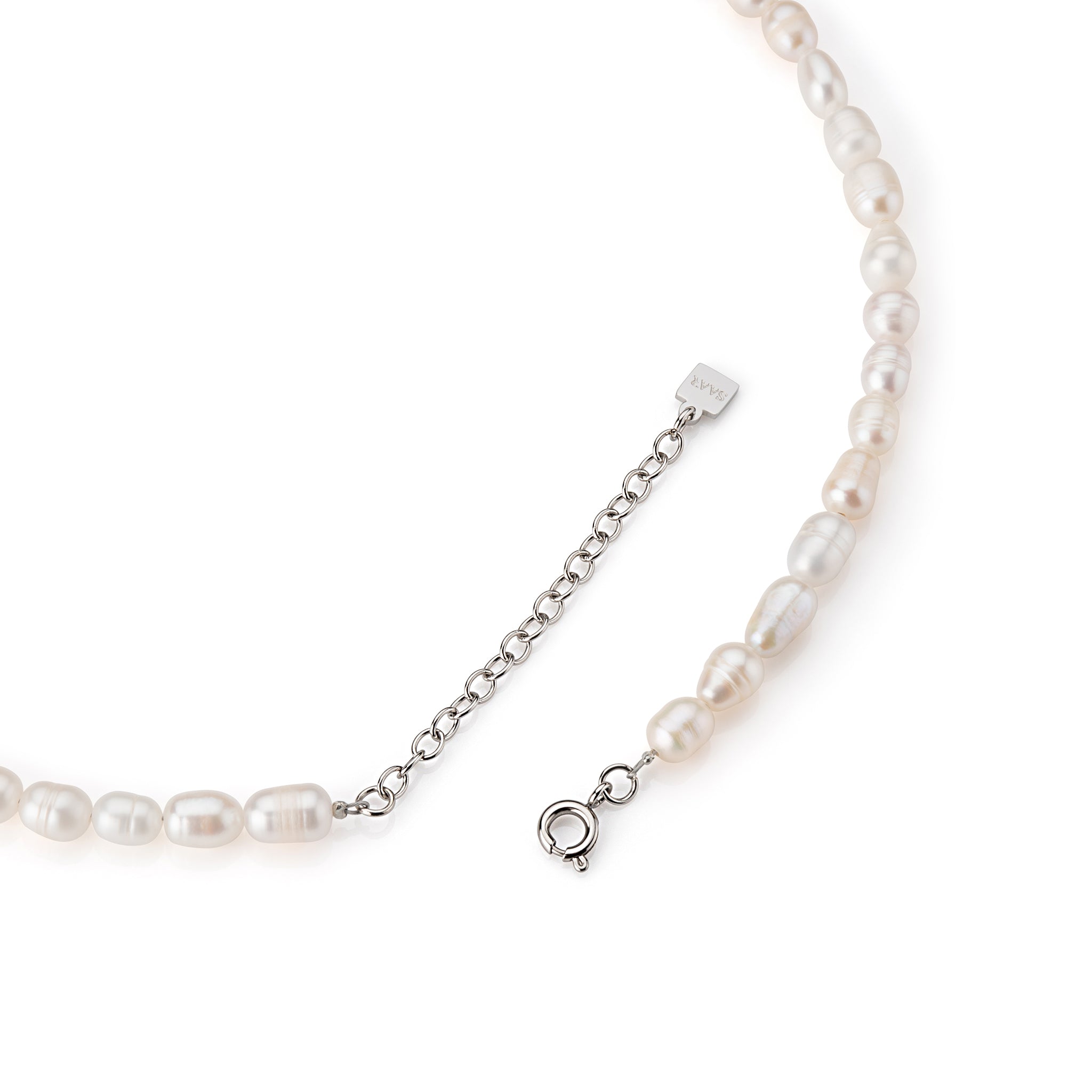 SAAR CO's AMY, a freshwater rice pearl necklace, the 5cm extension chain with SAAR CO's logo, and clasp.