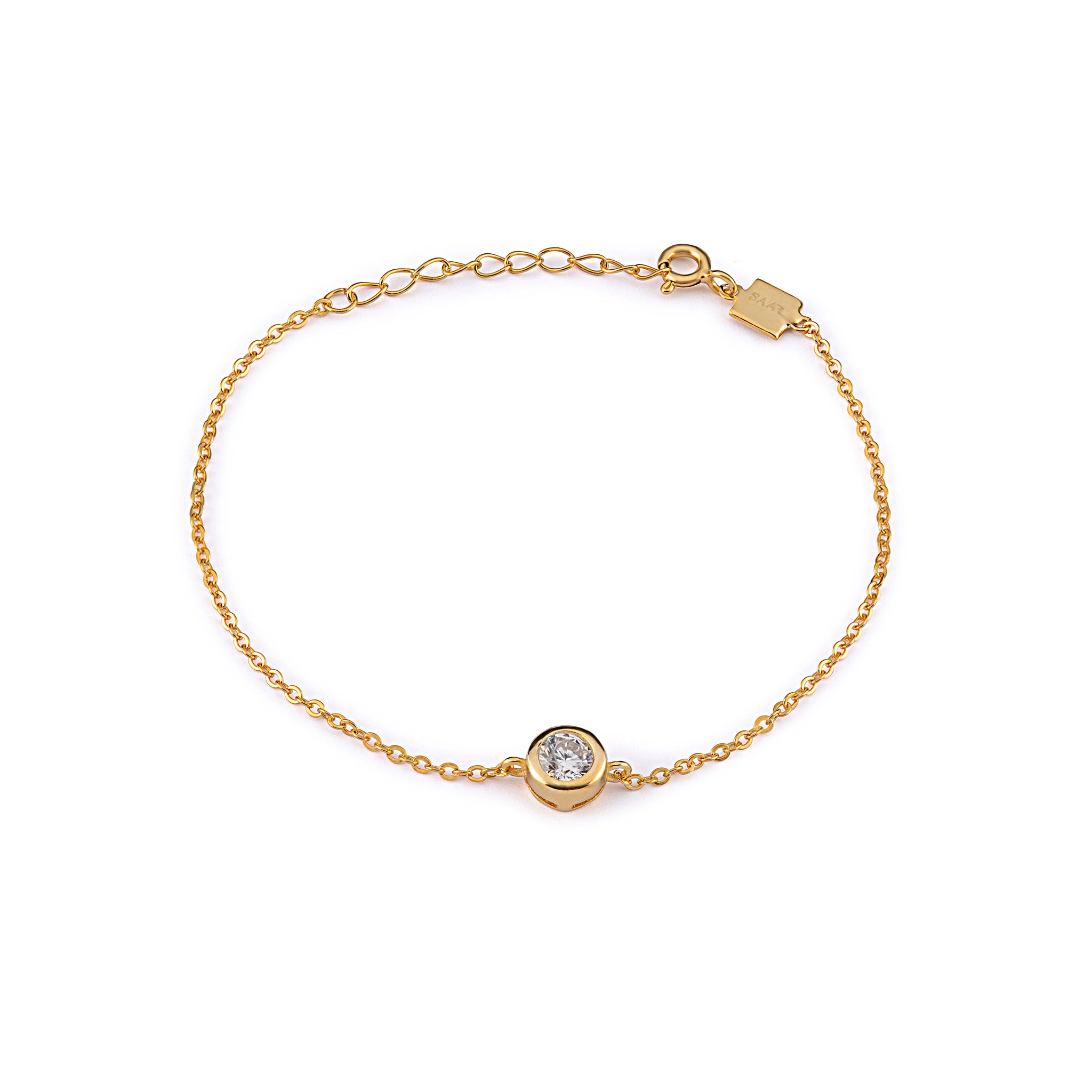 SAAR CO's JAMIE, an 18k gold vermeil chain anchored by a bezel-set round-cut zirconia.