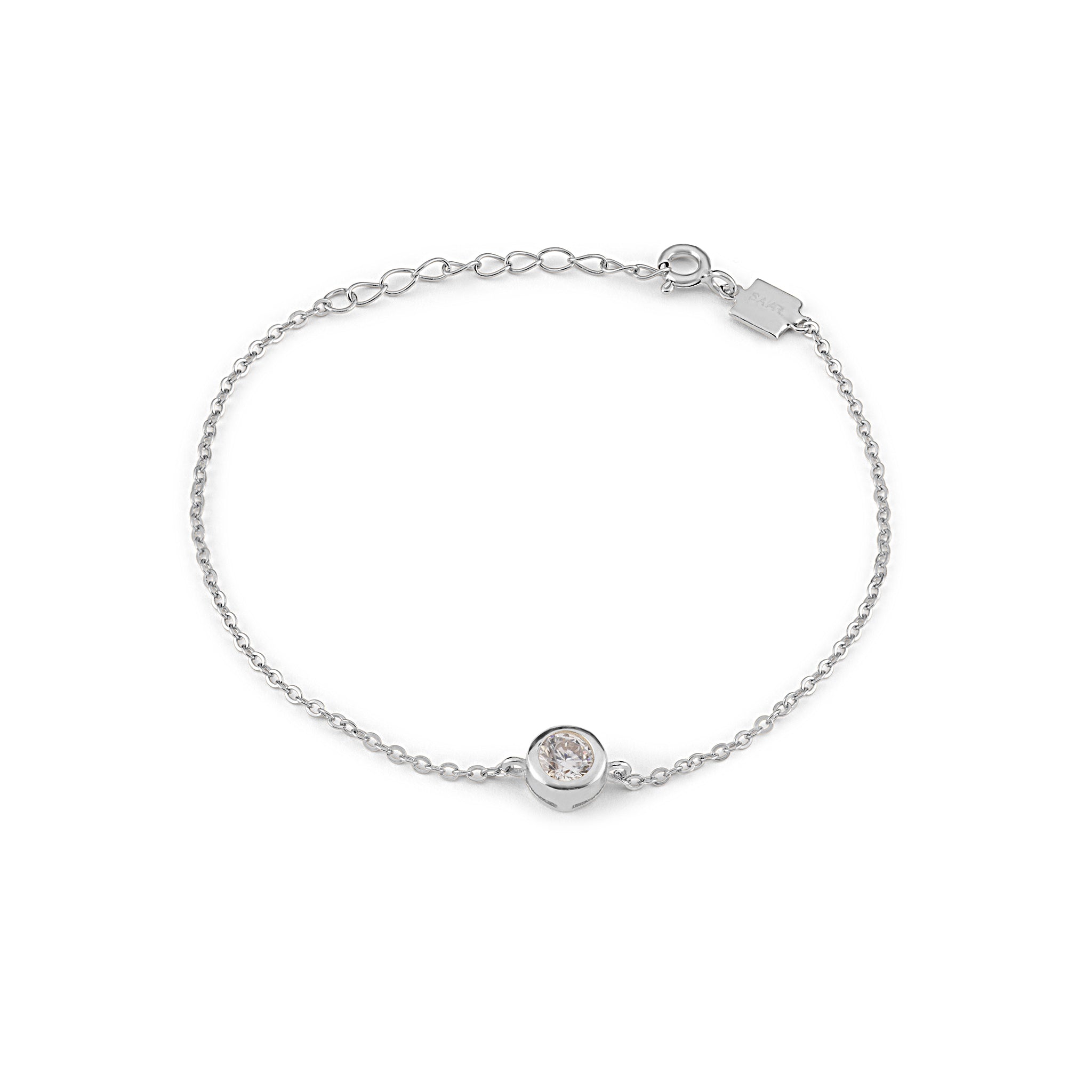 SAAR CO's JAMIE, an Stainless Steel vermeil chain anchored by a bezel-set round-cut zirconia.