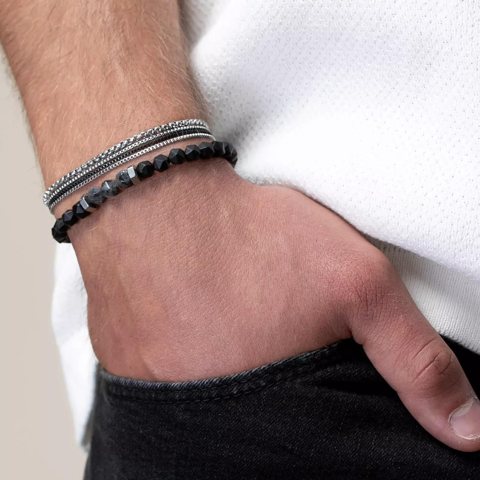 1 Stainless steel layered bracelet with a lobster clasp and 1 6mm diamond cut black Onyx gemstones elastic bracelet